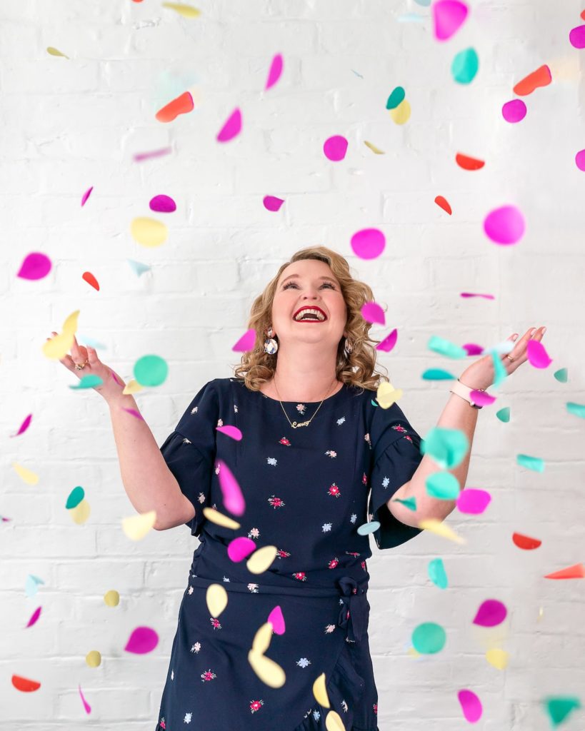 SEO Specialist Casey throwing confetti in the air to celebrate